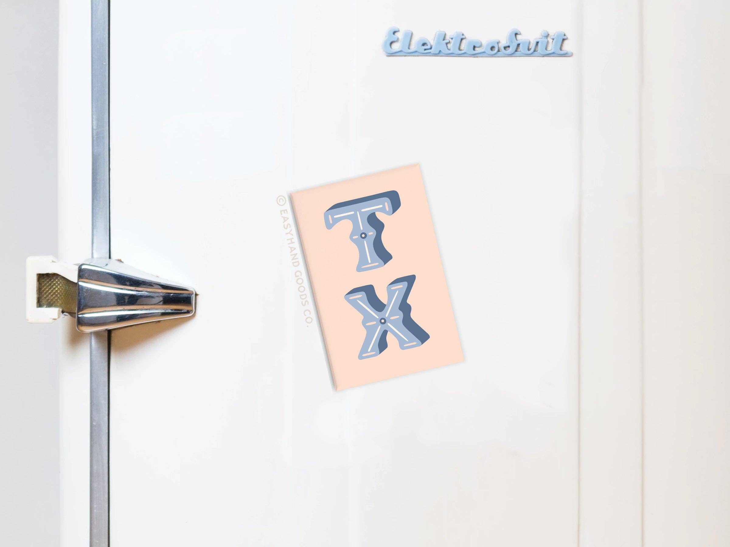 TX refrigerator magnet displayed on packaging