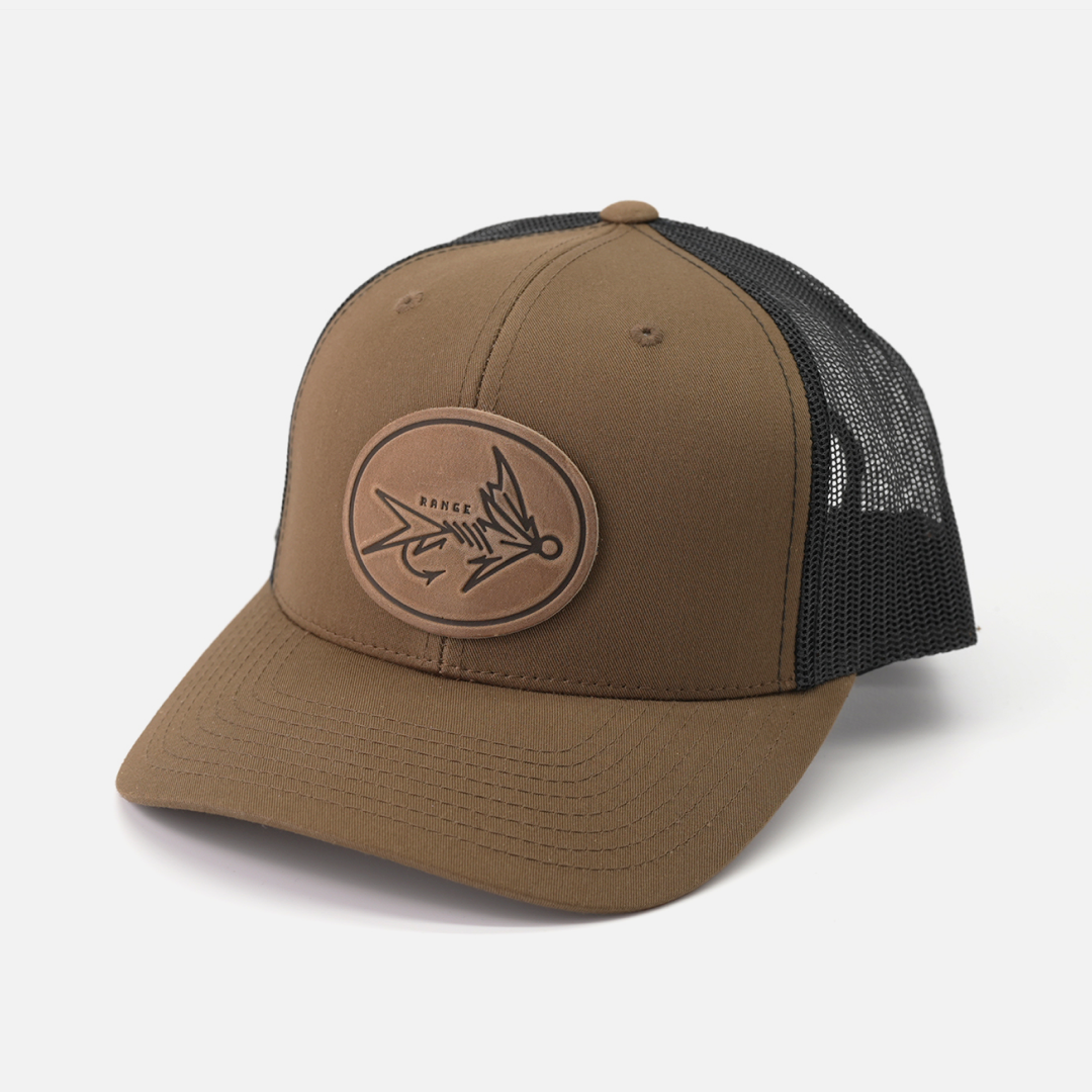 Range Fly Icon leather patch trucker cap worn on model