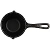 Lodge cast iron melting pot with brush in use
