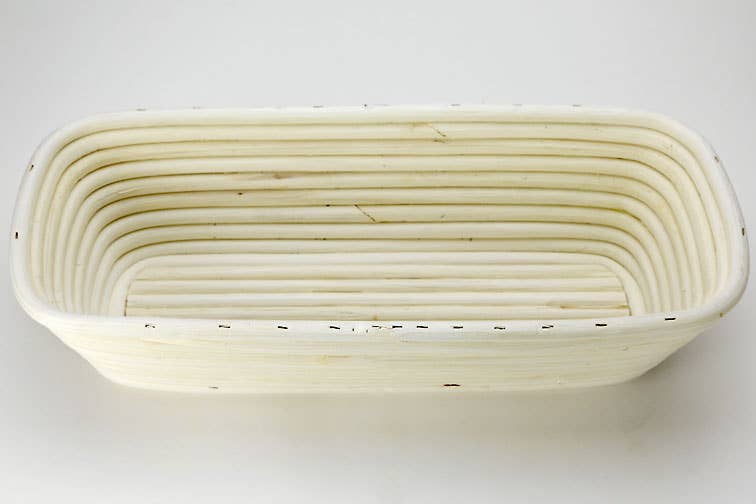 Oblong proofing basket and liner with bread dough