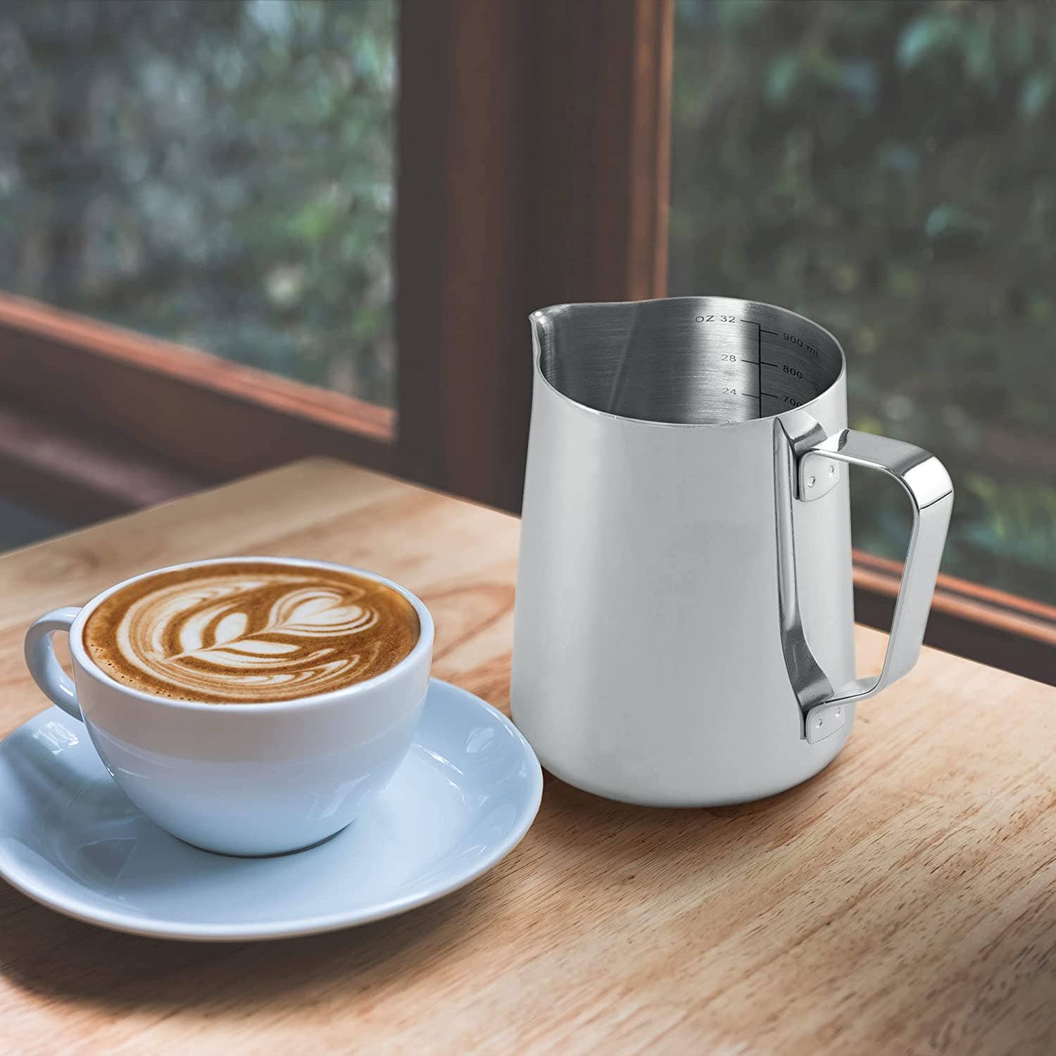 Stainless steel frothing pitcher ergonomic handle view