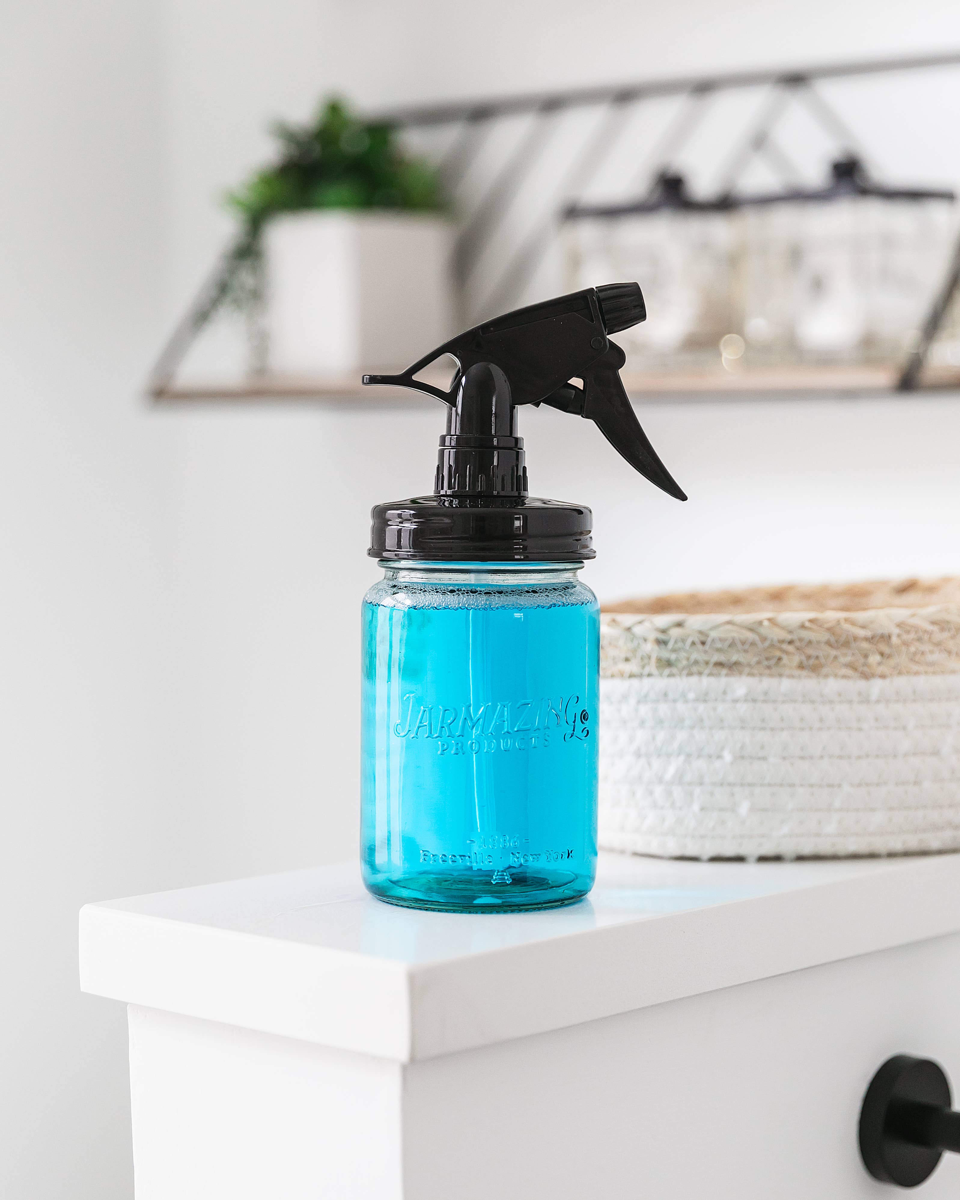 Blue glass mason jar sprayer packaging detail
