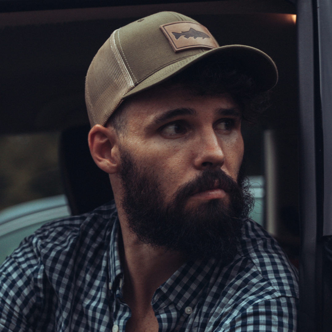 Trout Hat leather patch trucker cap angled view