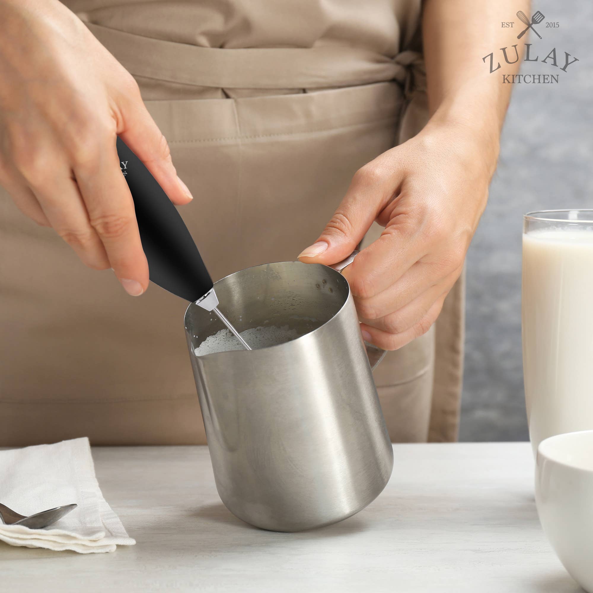 Stainless steel frothing pitcher handle detail