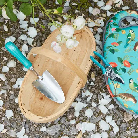 Flora and Fauna Trowel close-up with nature pattern
