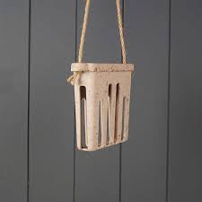 Earthy Sustainable suet cake feeder with suet installed