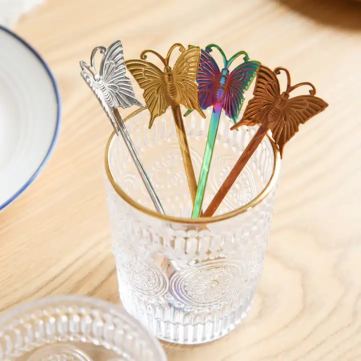 Butterfly spoons displayed in all four available colors