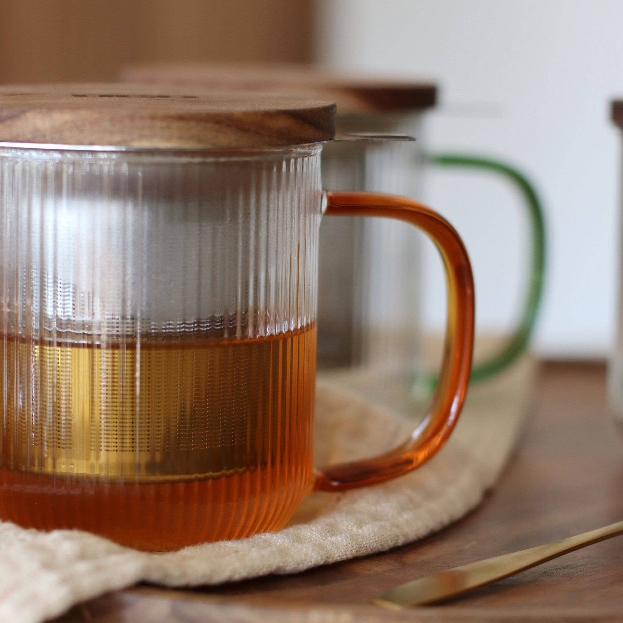 Karl glass tea pot with amber handle lifestyle view
