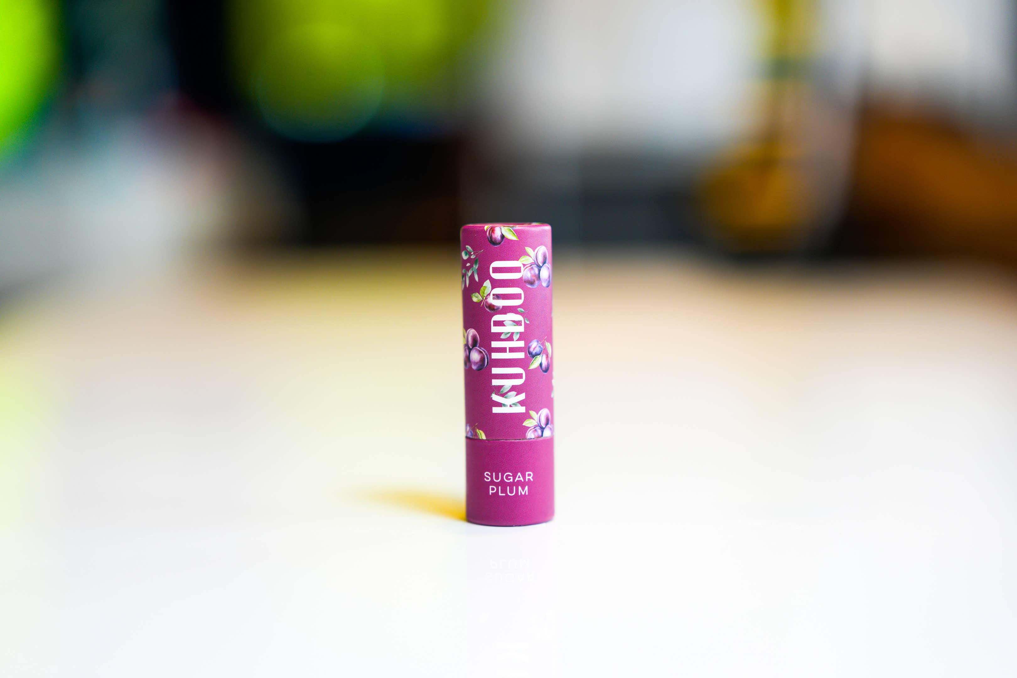 Sugar Plum Holiday lip balm tube front view