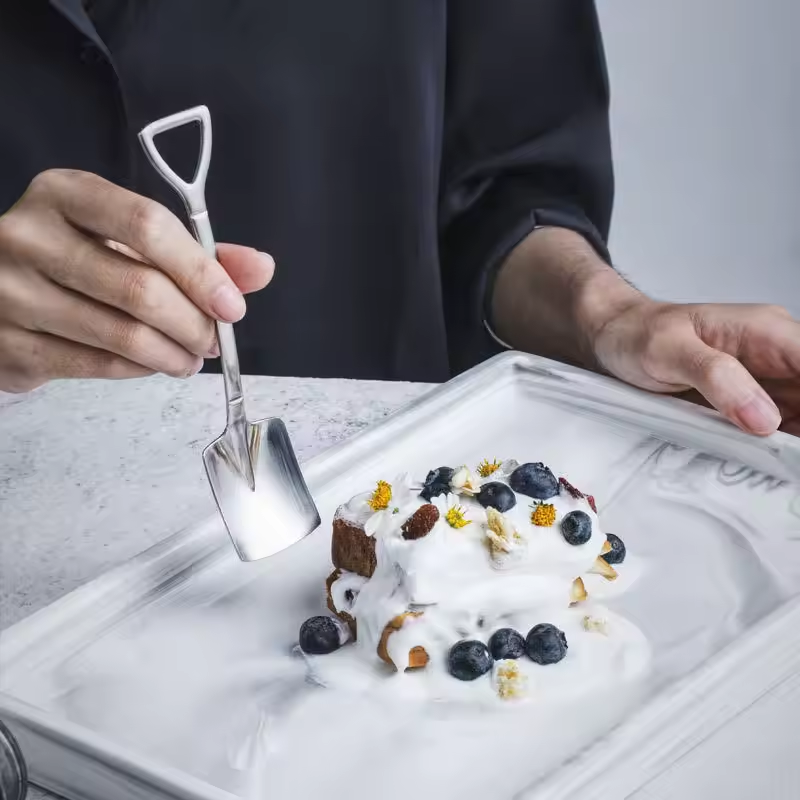 Shovel spoon shown with coffee cup