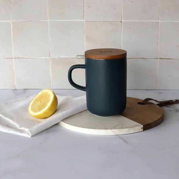 Blue Juliet stoneware pot with acacia lid lifestyle view