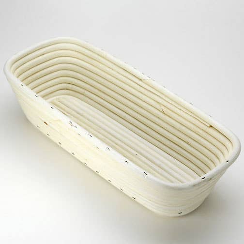 Oblong proofing basket showing woven rattan construction