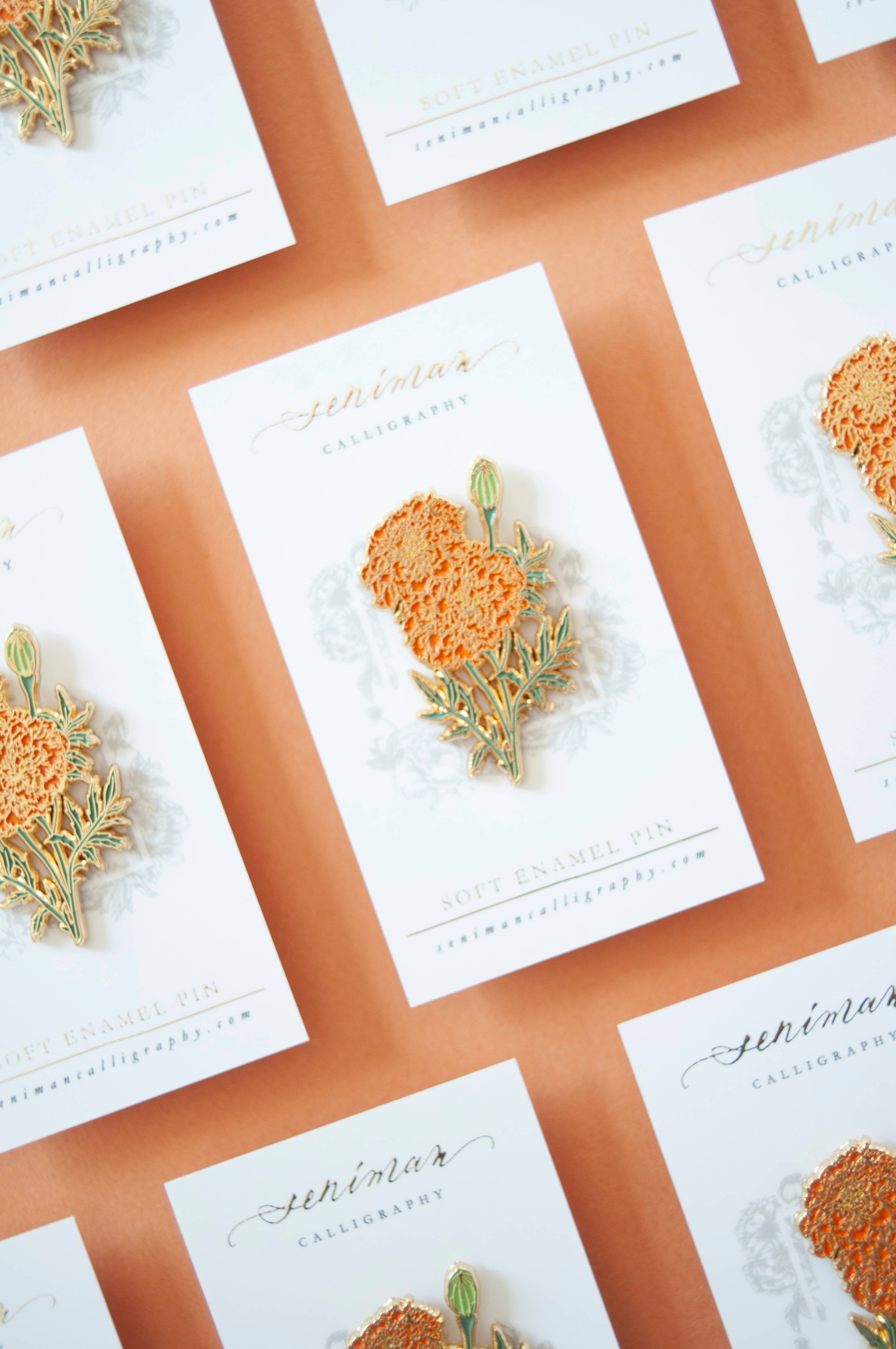 Marigold enamel pin with gold accents