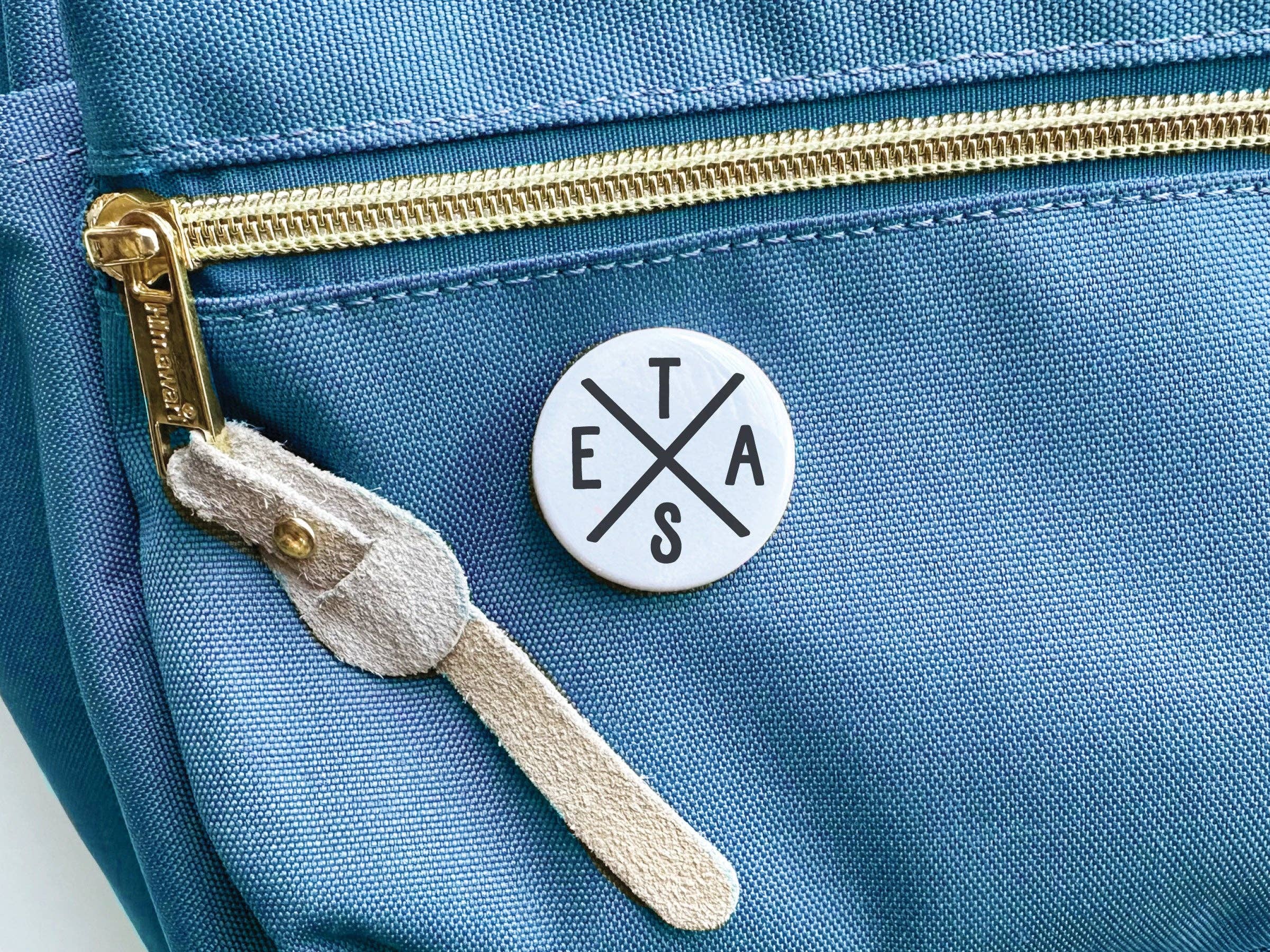 Texas Logo button shown at angle