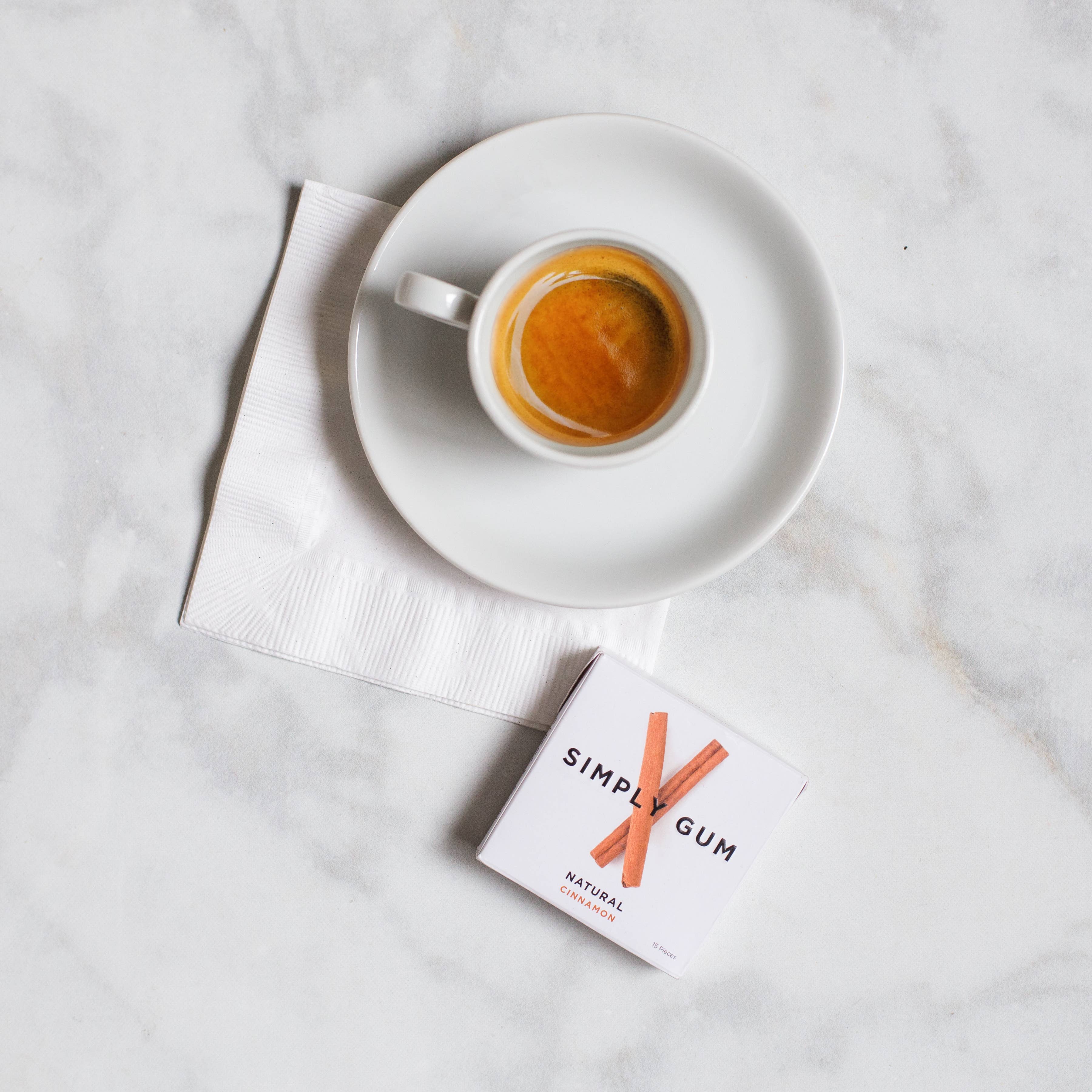 Natural cinnamon gum pieces spilling from open package