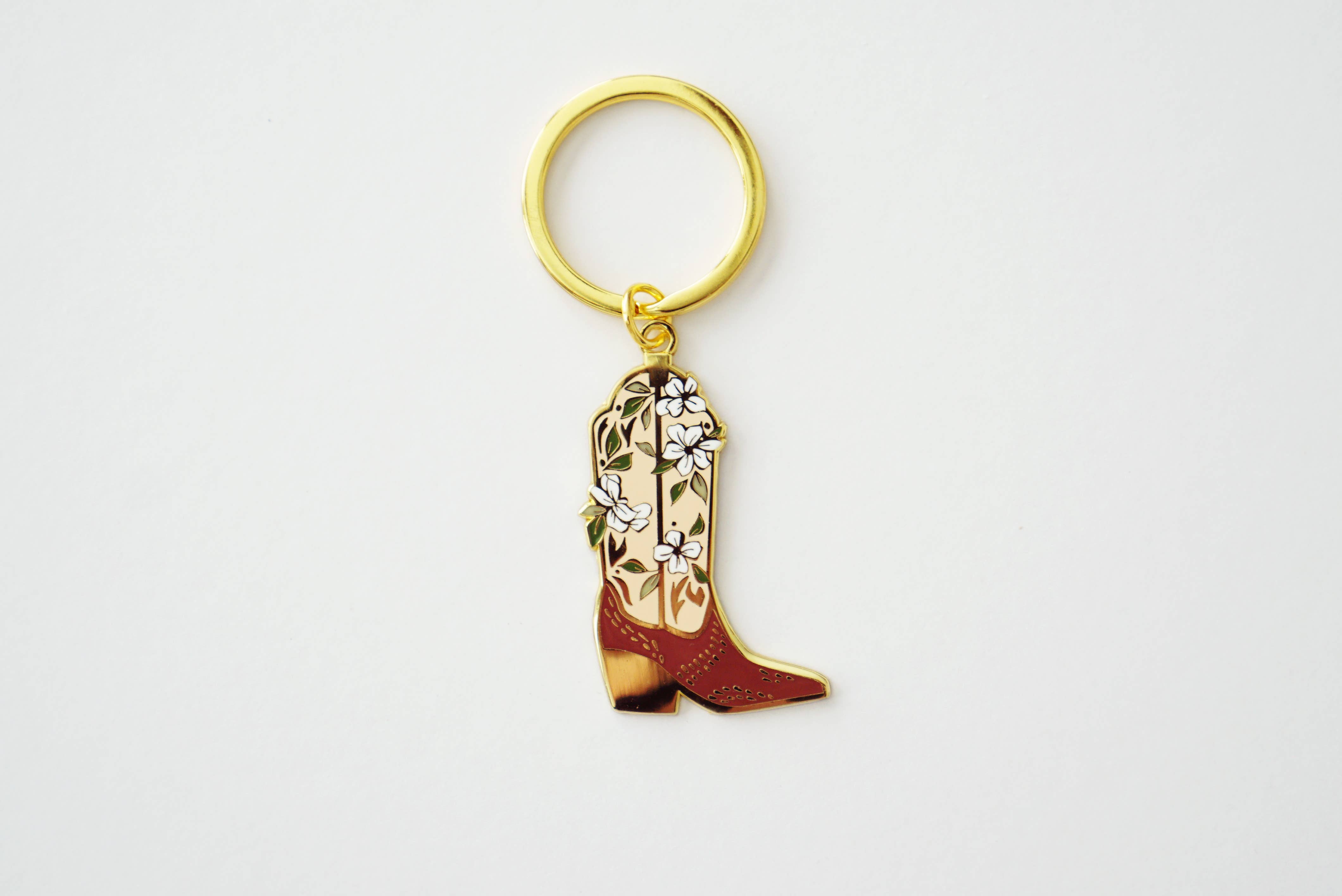 Western cowboy boot gold enamel keychain close-up
