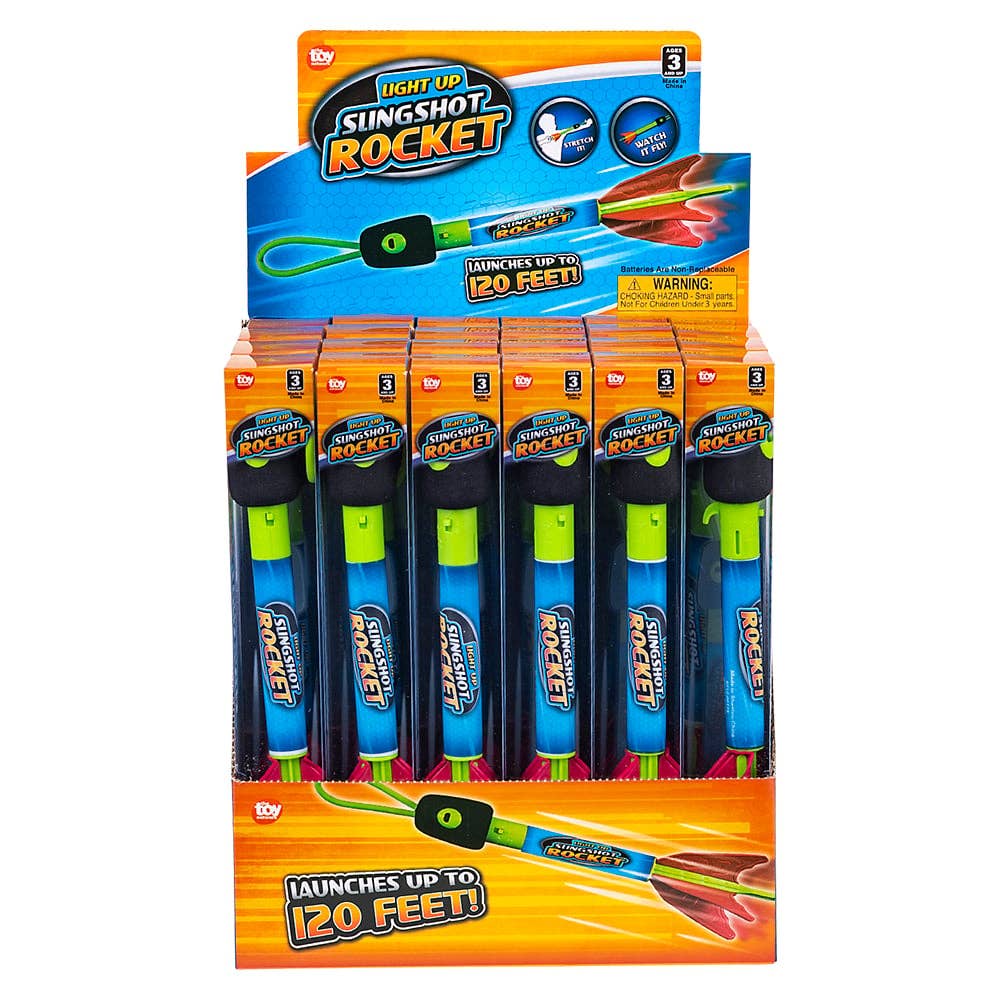 Light-up slingshot rocket toy launched into the air