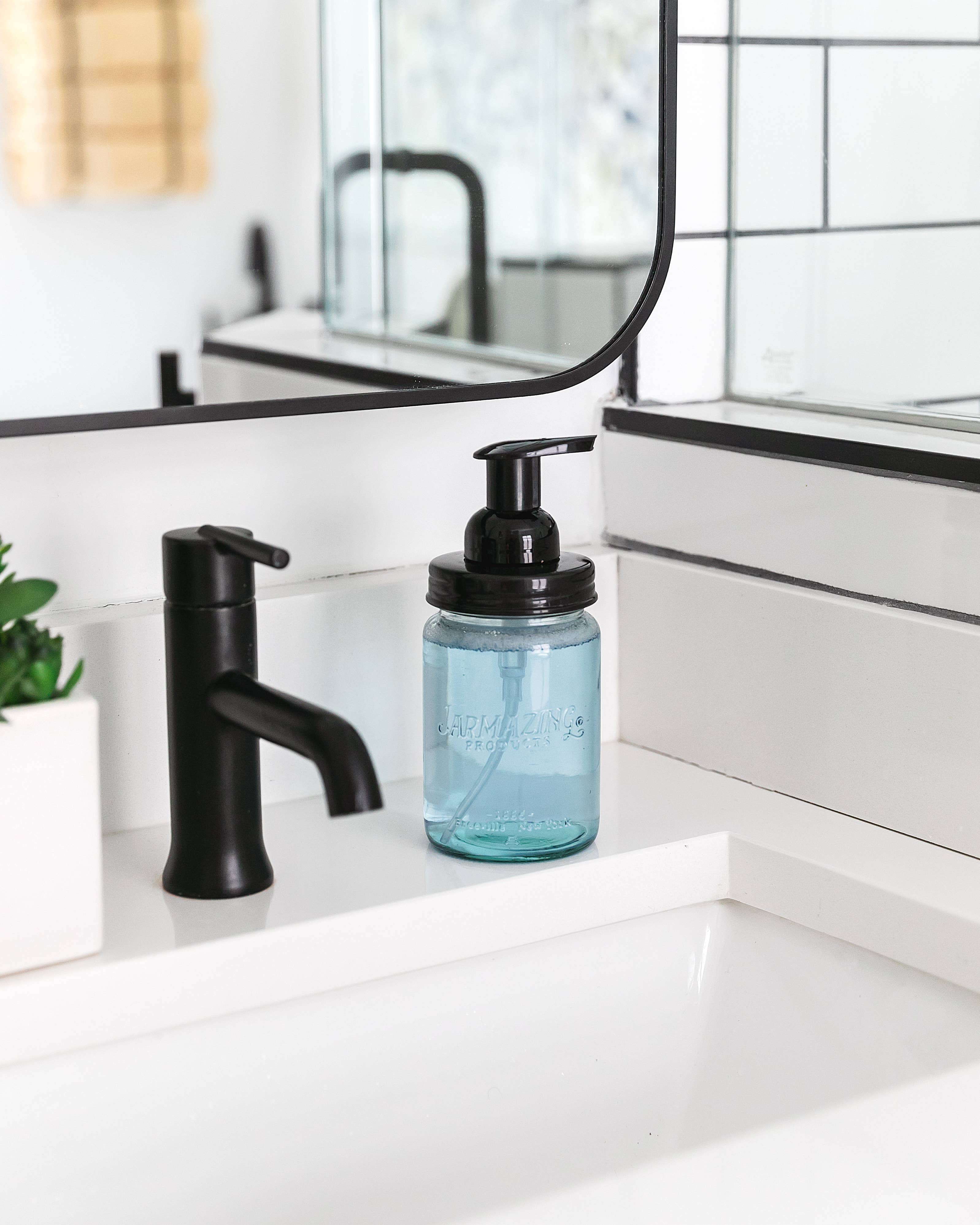 Blue glass mason jar foaming dispenser pair on display