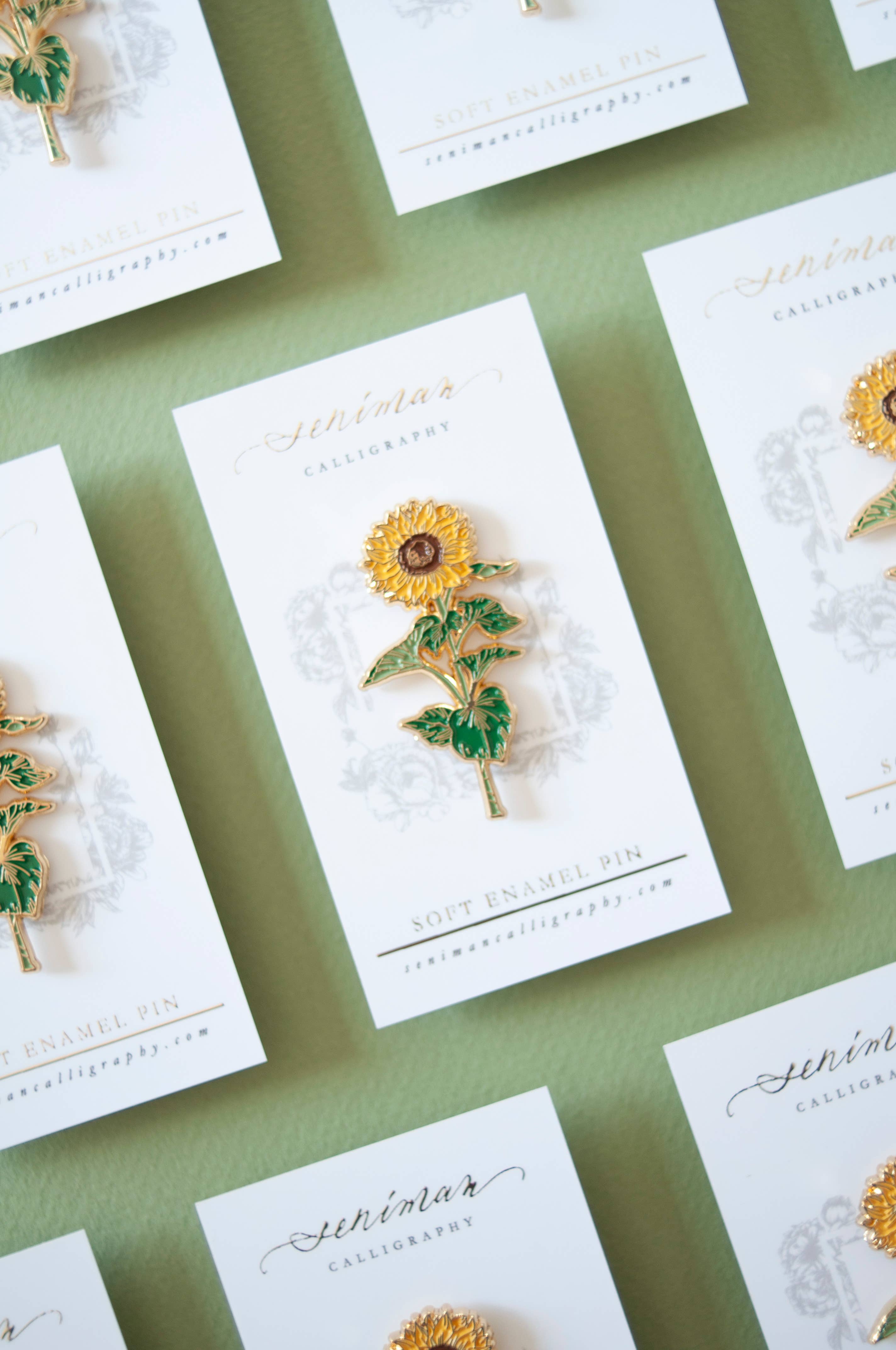 Sunflower enamel pin with gold accents