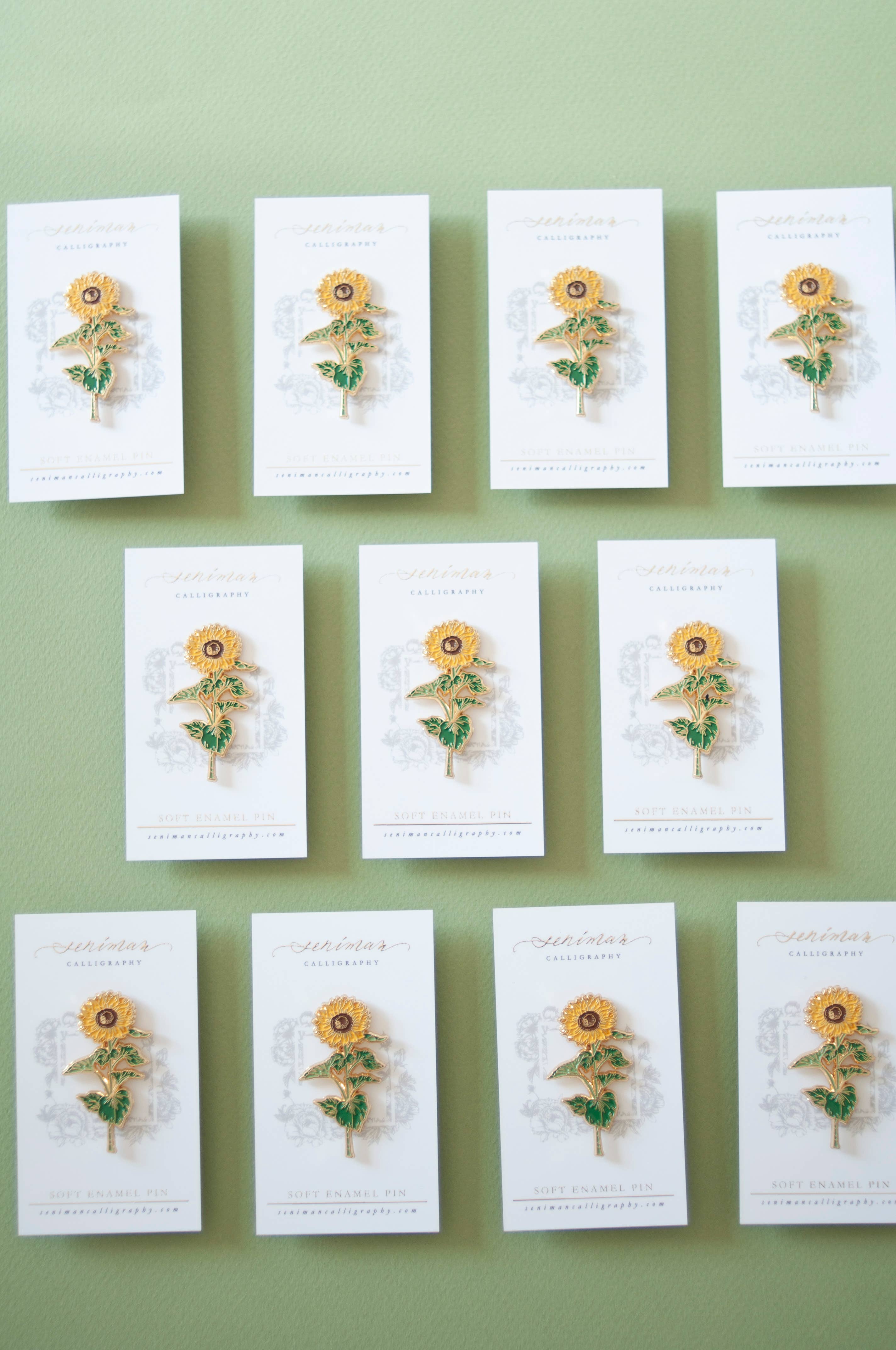 Sunflower enamel pin with golden petals
