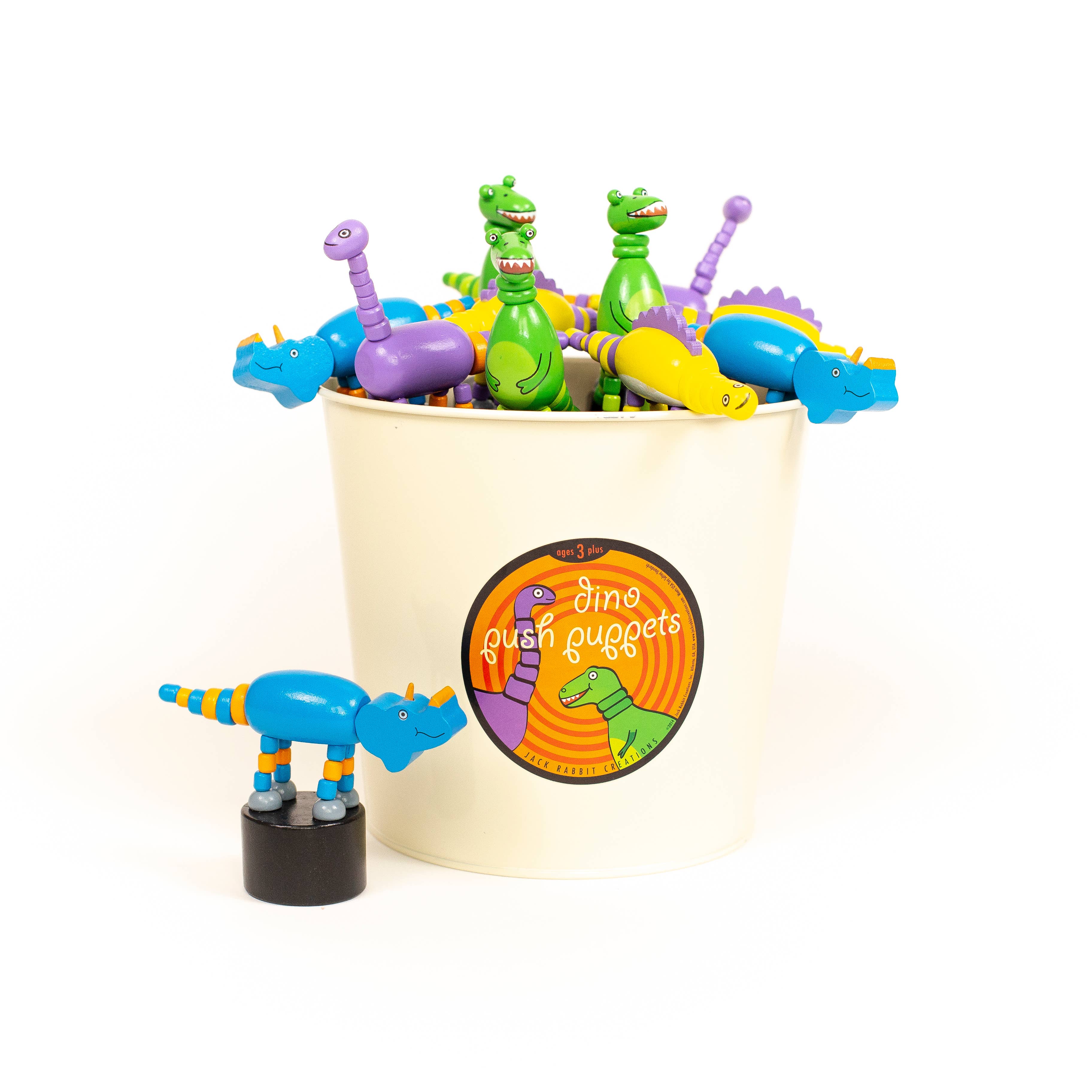 Colorful dinosaur push puppets displayed together