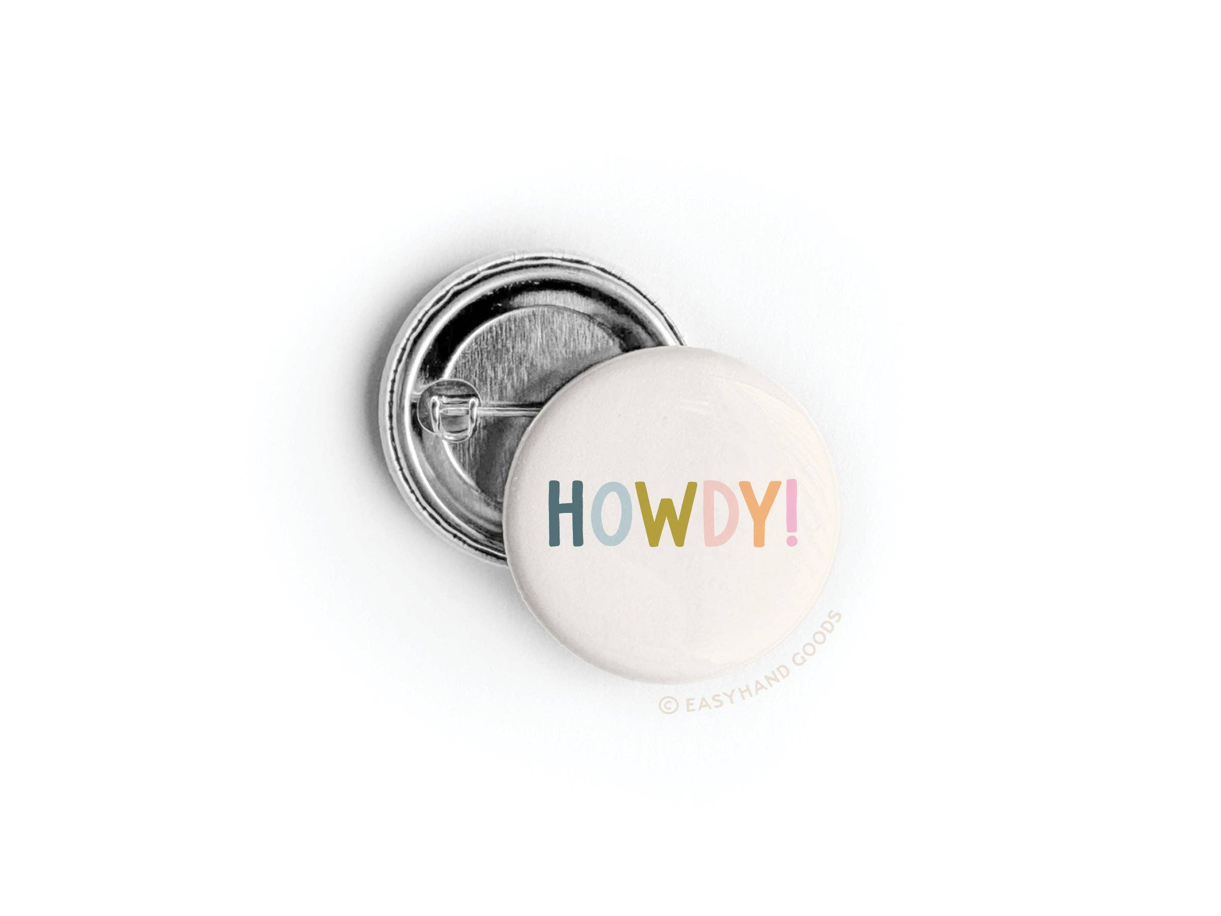 Howdy Button pinned on denim jacket