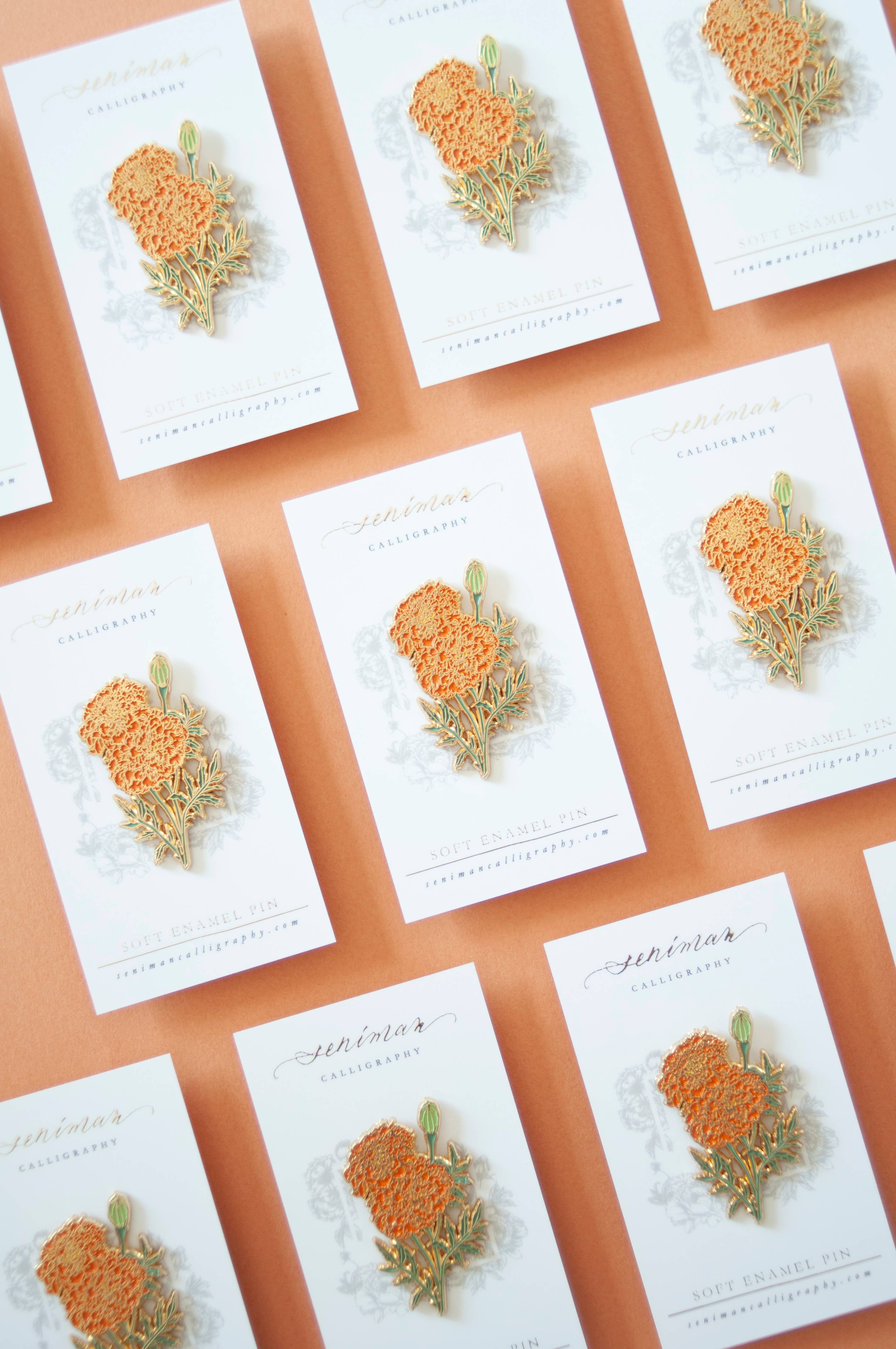 Marigold enamel pin on packaging card